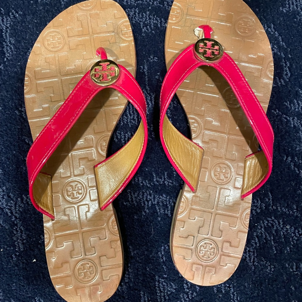 Tory Burch pink flip flops.